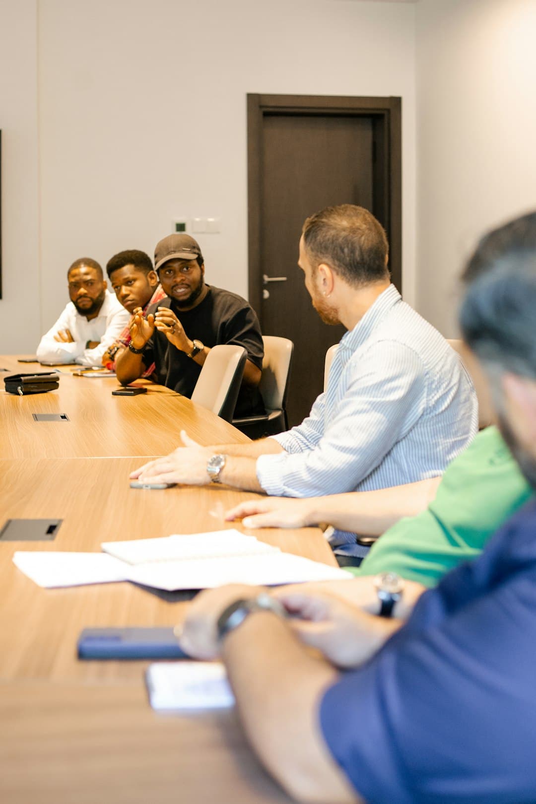Members from different countries discussing work together